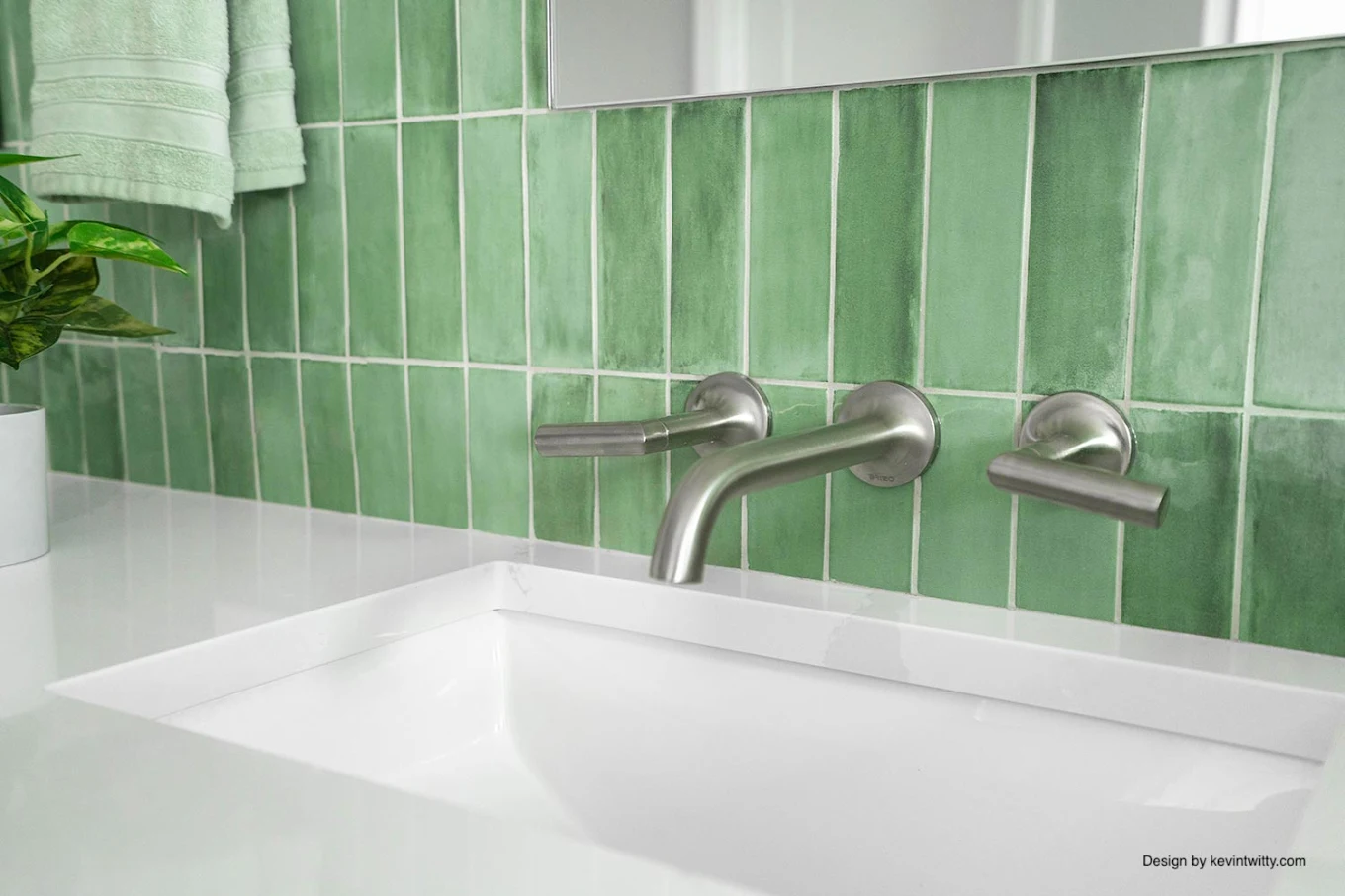 Brushed wall-mount faucet on handmade green tile